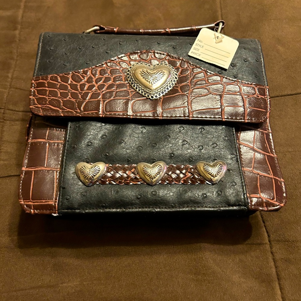 Hand crafted ostrich and alligator purse with heart accents.